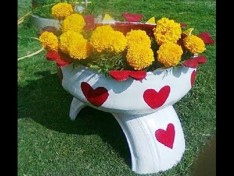 Такие клумбы из шин и покрышек можно сделать на даче  своими руками
